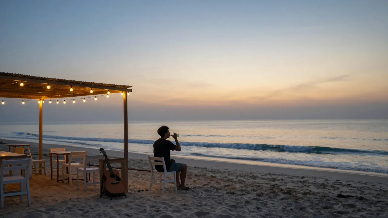 Quiet beach bar at sunrise with a solitary figure watching the dawn.