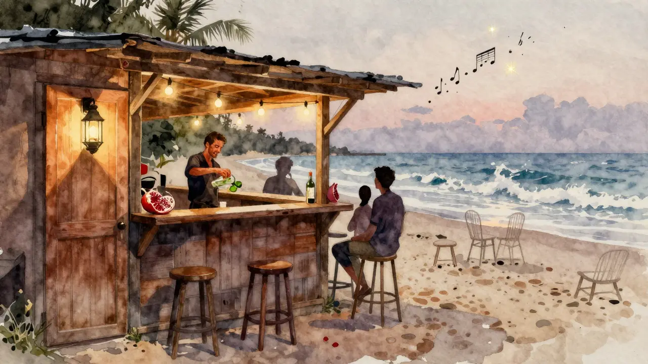 Beachfront Barasti with lantern, string lights, and Spicy Date Mojito at dusk.